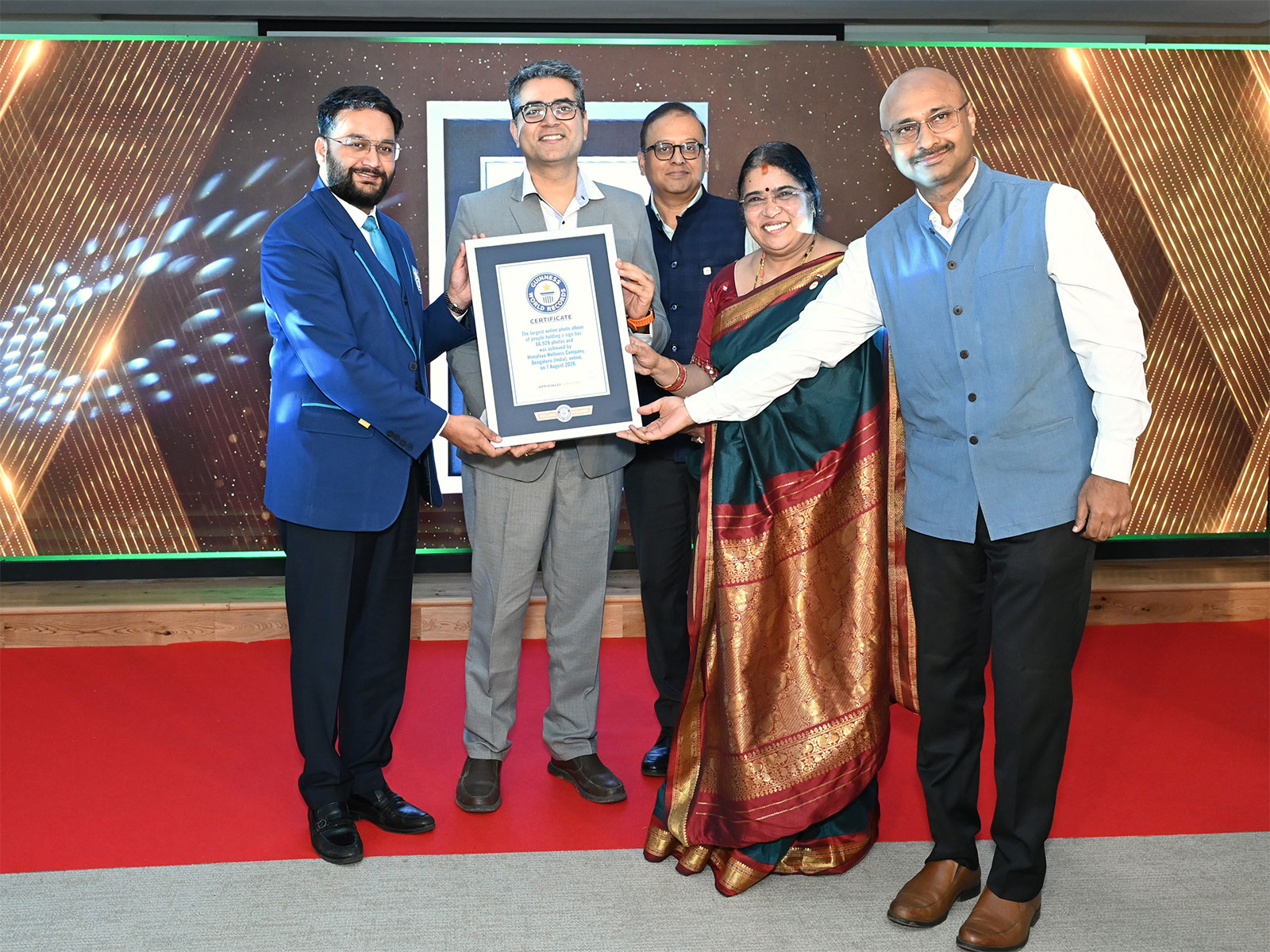 Himalaya Wellness leadership receives the GUINNESS WORLD RECORDS™ certificate for uniting 66,928 healthcare practitioners for sustainability.