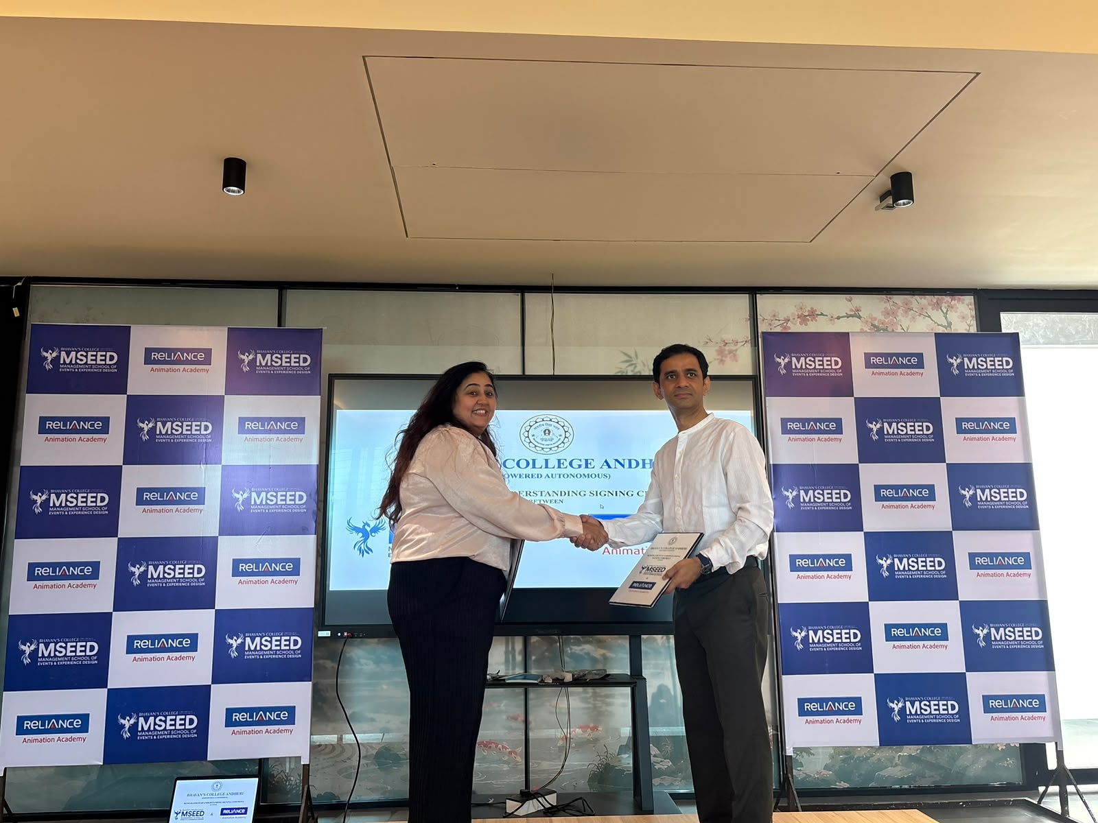 Agreement signing between Jimmy Choudhary, Director, MSEED Private Limited and Tejonidhi Bhandare, CEO, Reliance Animation Studios Private Limited