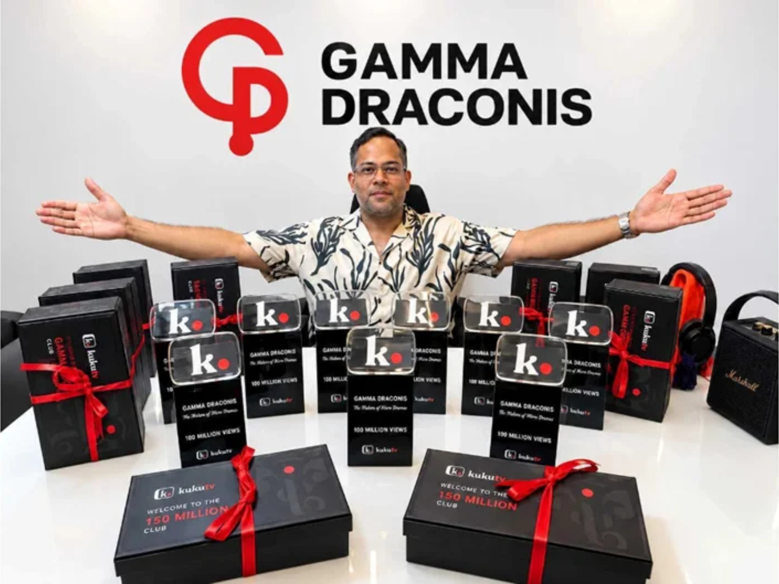 Praveen Kumar Kuril, Founder, Gamma Draconis, with Kuku TV’s “100 Million Views” awards and “150 Million Club” recognition