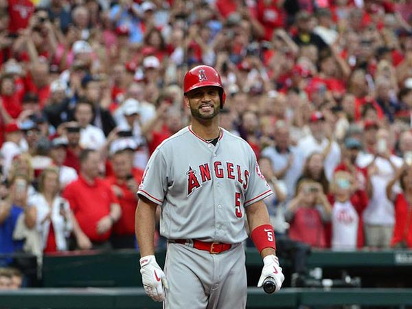 Baseball legend Albert Pujols takes the jersey off his back for young fan with Down syndrome