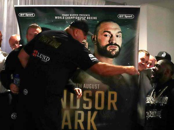 Deontay Wilder gatecrashes Tyson Fury weigh-in to trade insults with rival