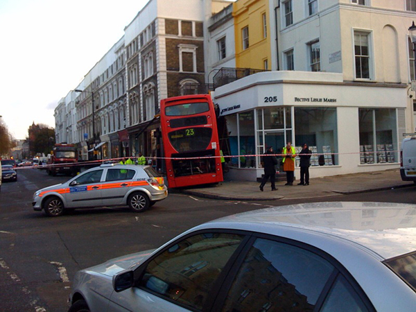 Double-decker London bus crashes into front garden