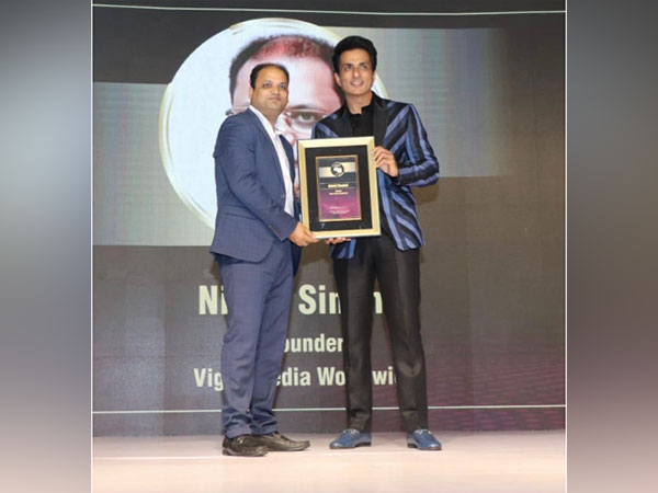 Nikhil Singhal receiving the prestigious award from Sonu Sood