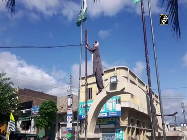 Watch: Activist in PoK brings down Pakistani flag