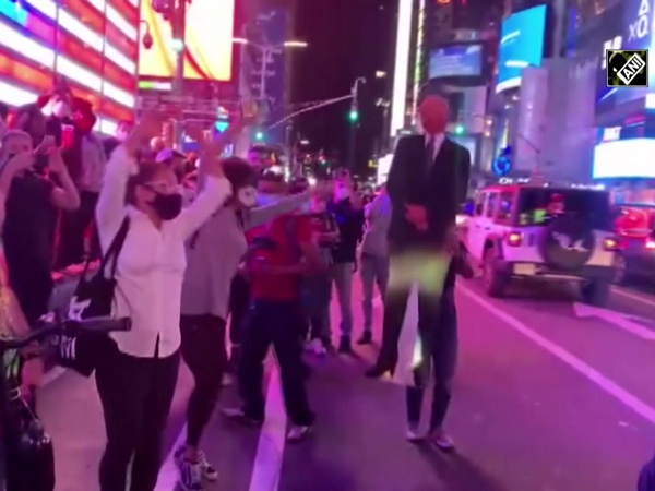 Celebrations pour at New York’s Times Square as Biden clinches presidency