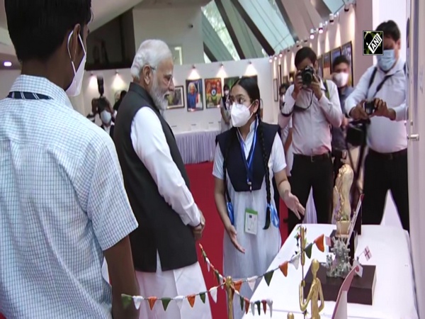 PM Modi checks out exhibition projects made by students at Talkatora Stadium