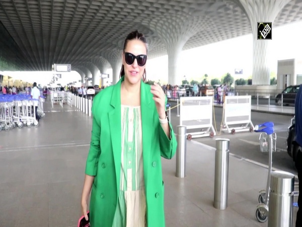 Neha Dhupia flaunts her grey hair at Mumbai airport