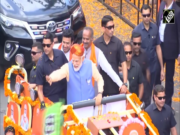 Continuous flower shower on PM Modi during electrifying roadshow in Bengaluru