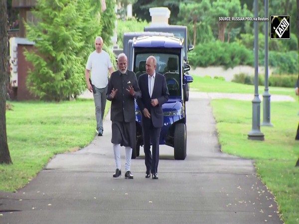 Russian President Vladimir Putin drives PM Modi in his electric car; gives a tour of Presidential house