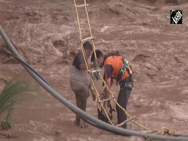 After heavy overnight rain, man trapped in the swollen Tawi river in Jammu rescued safely by SDRF