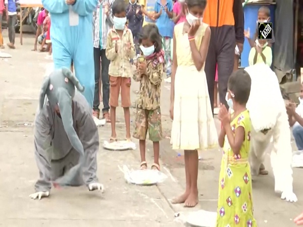 Dressed as cartoon characters, NGO members cheer up Mumbai slum kids