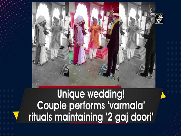 Unique wedding! Couple performs ‘varmala’ rituals maintaining ‘do gaj doori’